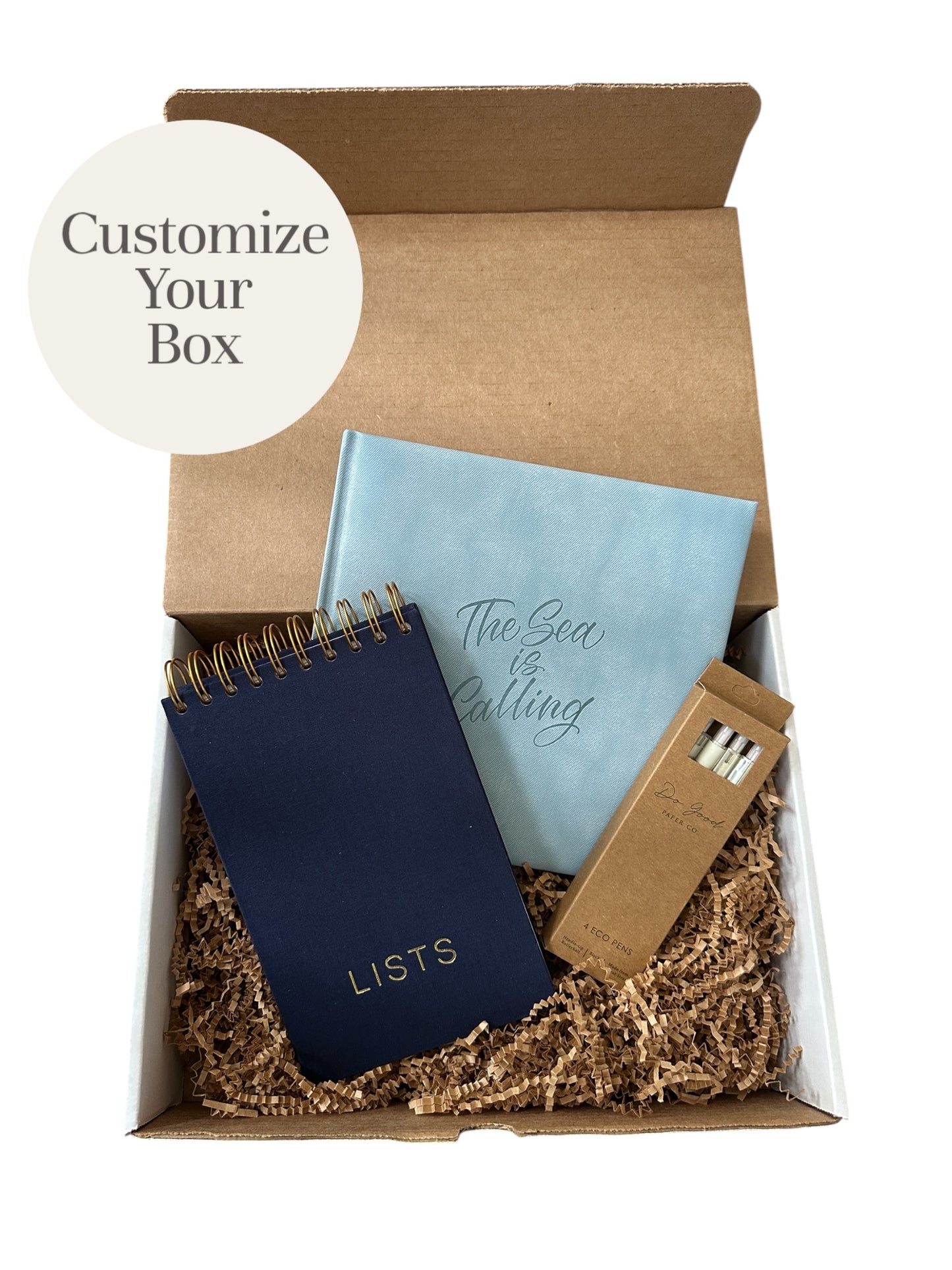 customized stationery box with a blue square journal, a navy LISTS spiral notepad and a 4-pack of eco pens