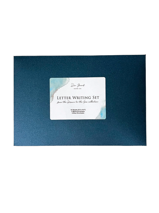 Stationery set in blue outer envelope with ocean-themed watercolor design